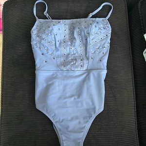 One piece, dark grey bathing suit with cute detailing